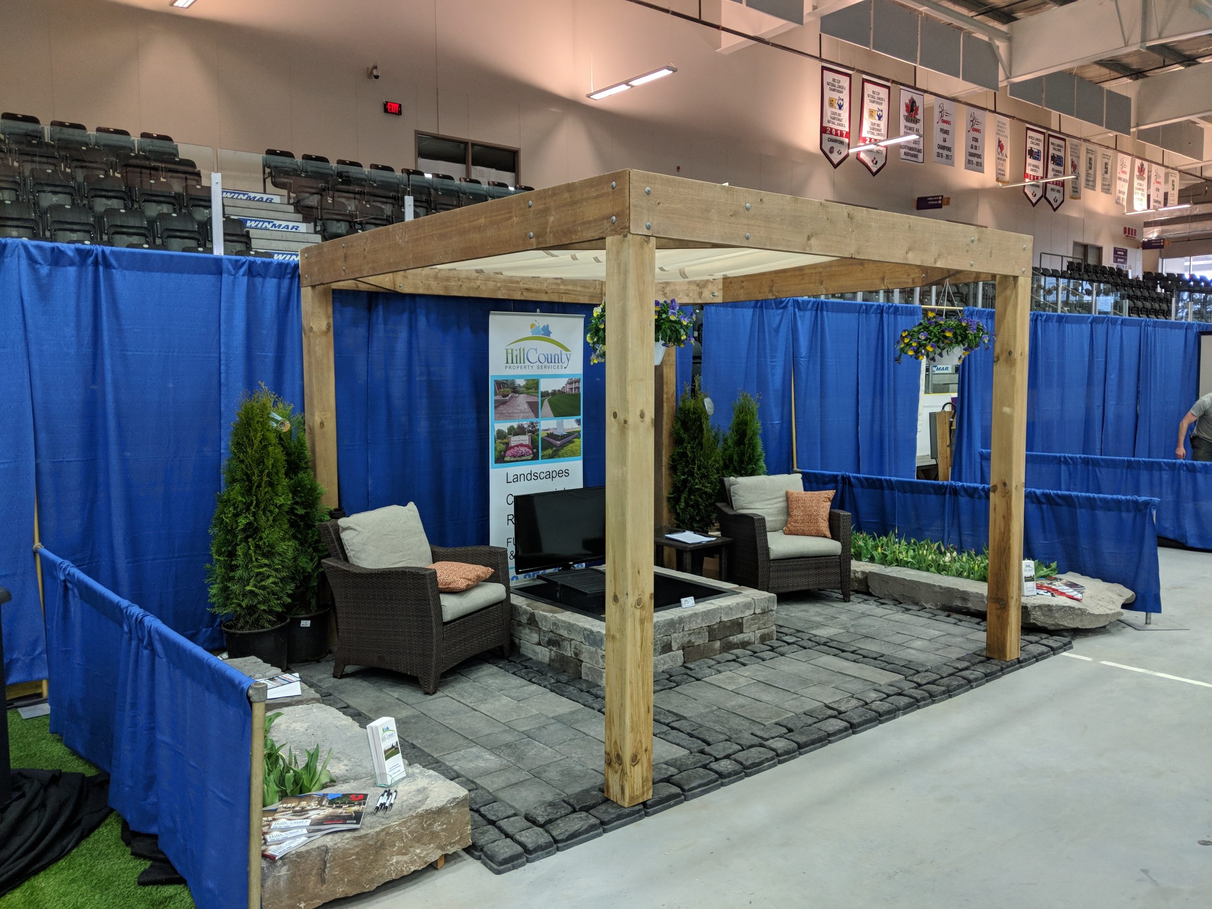 Trade show booth with outdoor landscaping display.