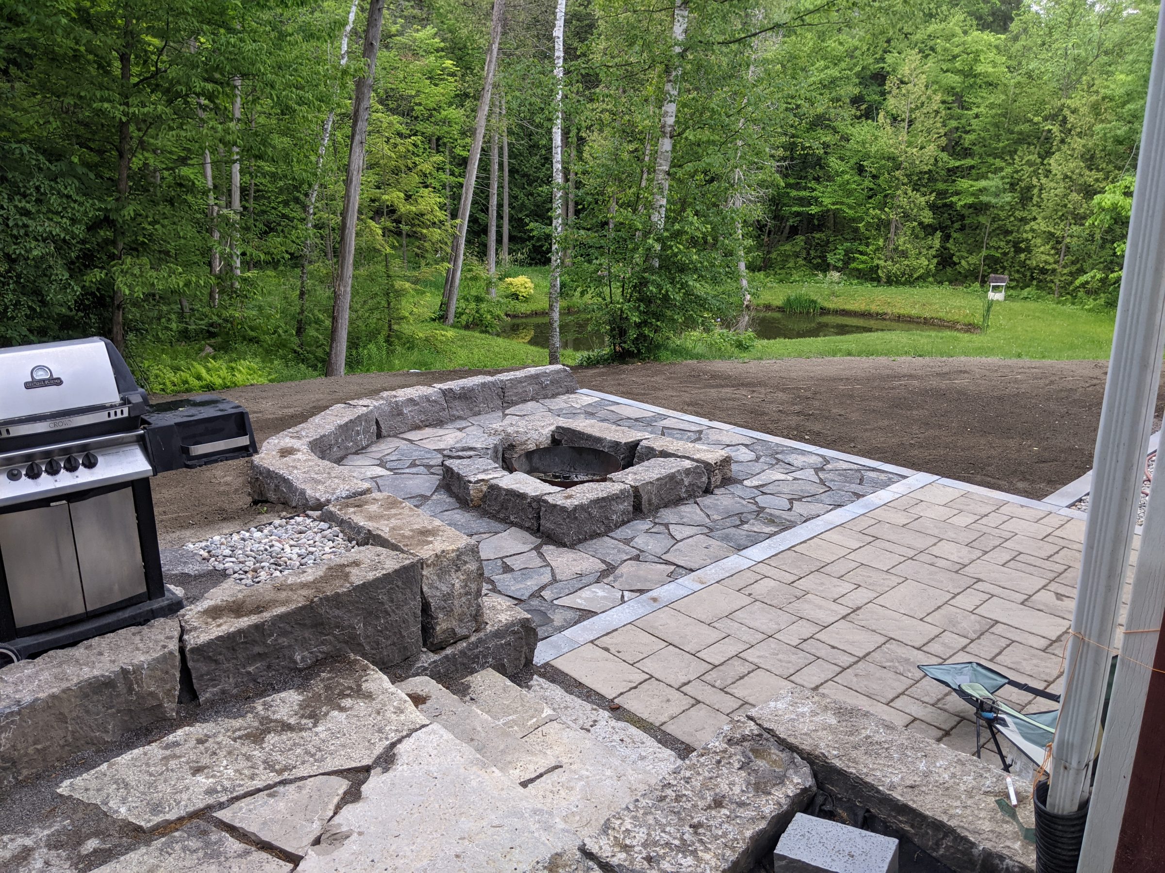 Backyard patio with grill and firepit
