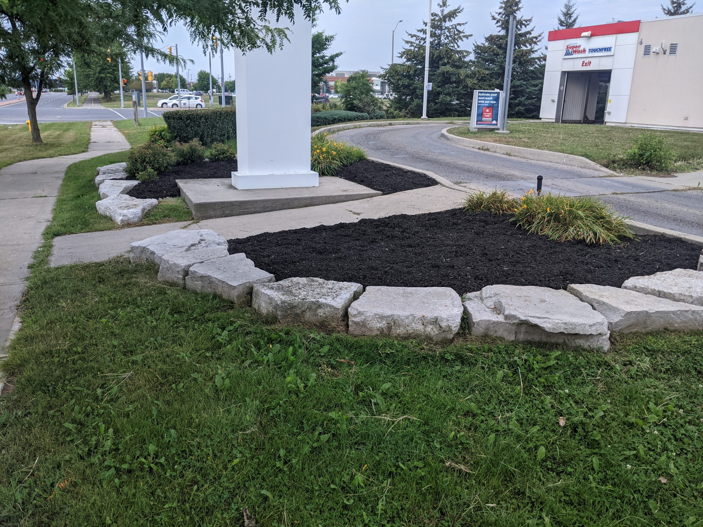 Landscaped area with rocks and mulch.