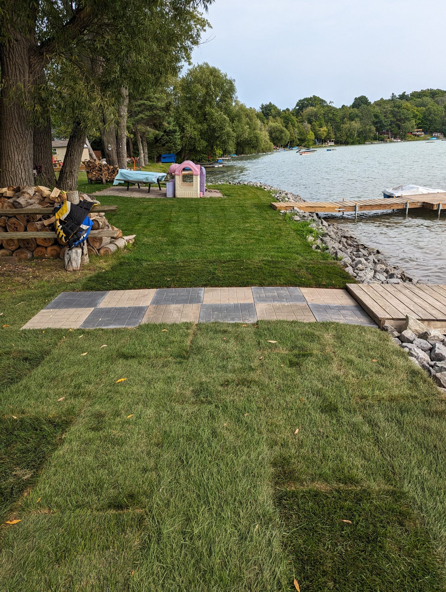 Lakeside lawn with dock and picnic area