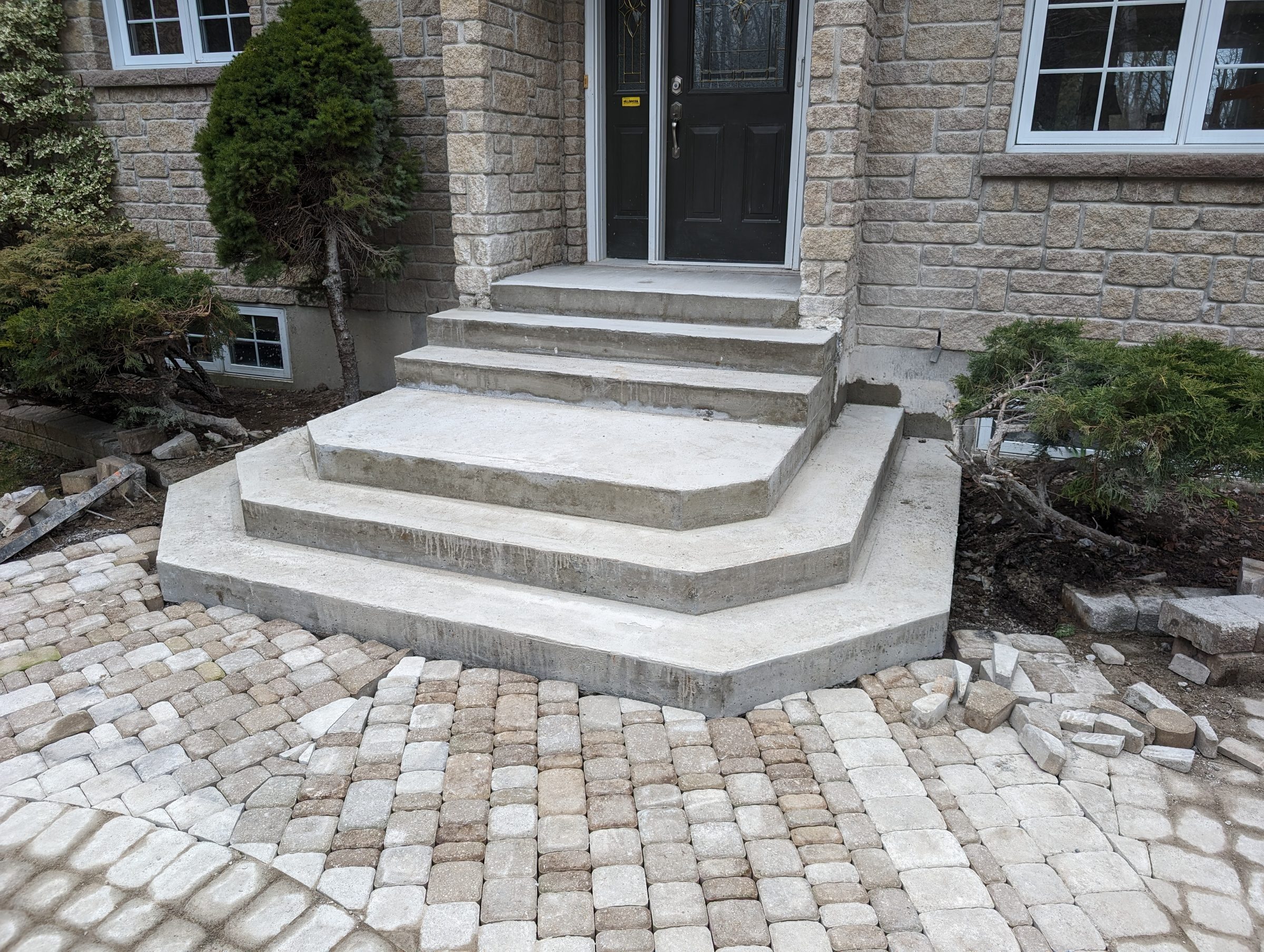 Stone steps leading to a front door entrance.