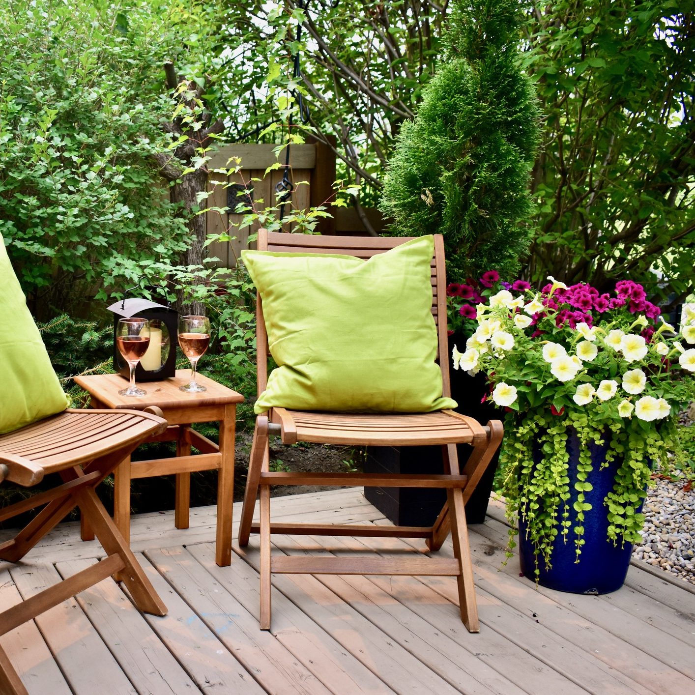 Cozy garden seating with flowers and wine.