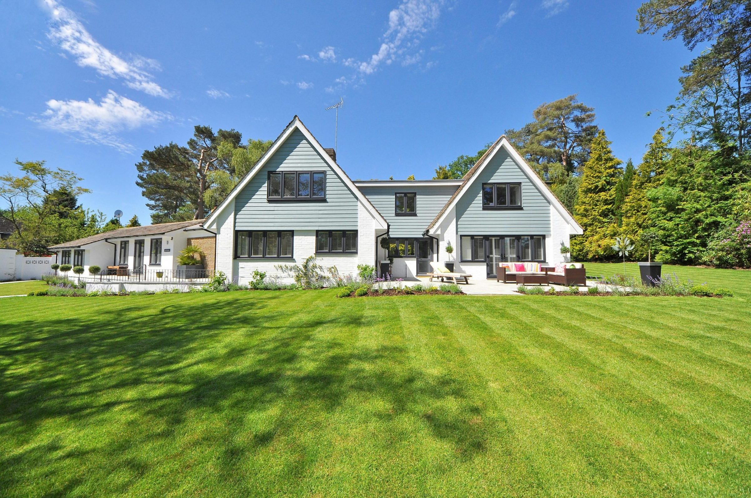 Modern house with large green lawn